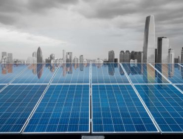 beautiful city twilight reflected on the solar energy panels