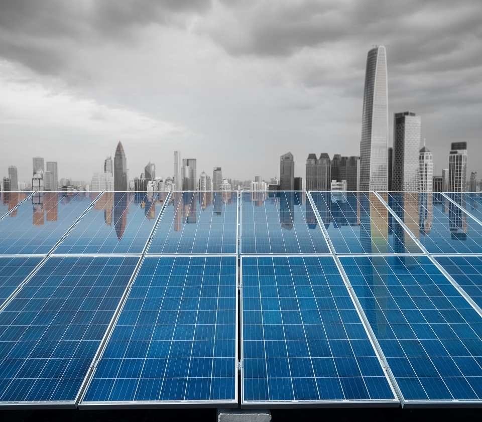 beautiful city twilight reflected on the solar energy panels